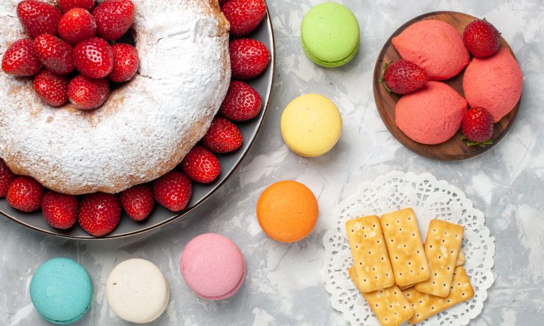 top view strawberry cake with fresh strawberries and macarons on light-white background pie cake biscuit sugar sweet